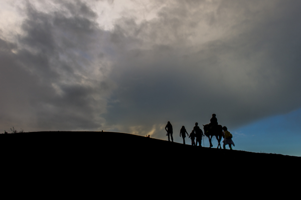 Our group hiking up Pacaya volcano as the sun sets. 