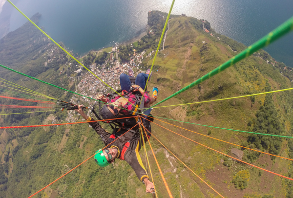 I hate selfie sticks, but they definitely come in handy while paragliding. 
