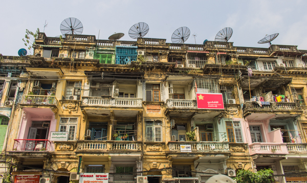 An old colonial building that has been converted into apartments.